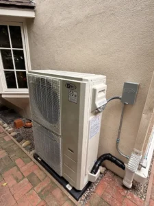homeowner looking at old HVAC unit outside home - should i repair or replace my hvac system
