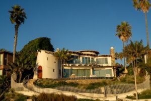 modern San Diego home exterior with blue sky and lush landscaping - does a new hvac help sell your home faster